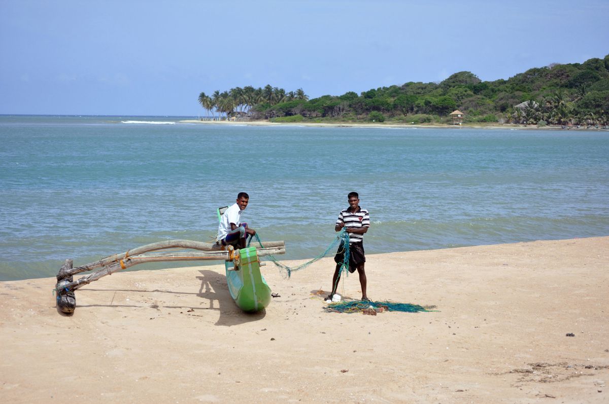 fishermen in the morning at the beach of Arugam Bay in Sri Lanka