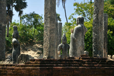 group of three ancient statues in the Mudu Mahavihara in Potuvil