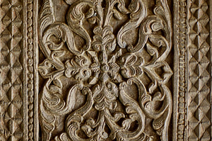 woodcarving at a pillar of the Ambekke Devalaya