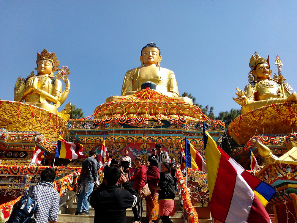 Buddhist statues at the so-called monkey temple of Swayambhunath stupa near Kathmandu in Nepal 