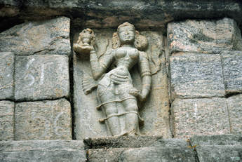 female figure at the front of the ornate stairway of Yapahuwa