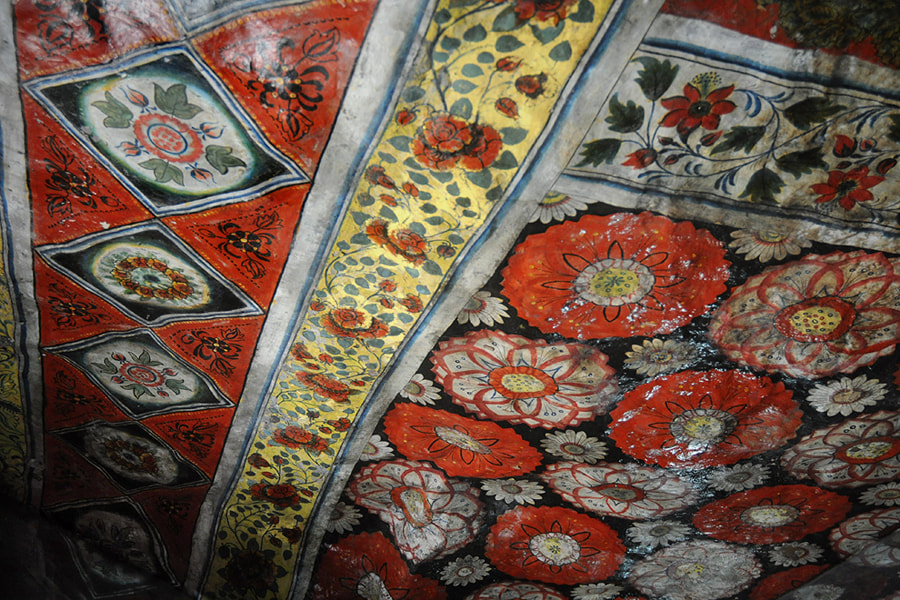 flowers depicted at a mural in a cave shrine of Mulkirigala