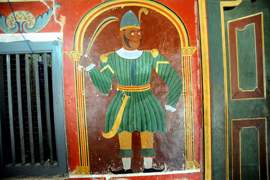 painted Portuguese soldier as Dvarapala