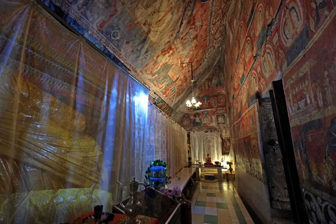 Buddhist cave temple in Hindagala with murals from the Kandy period and a rare rock painting from the Anuradhapura period