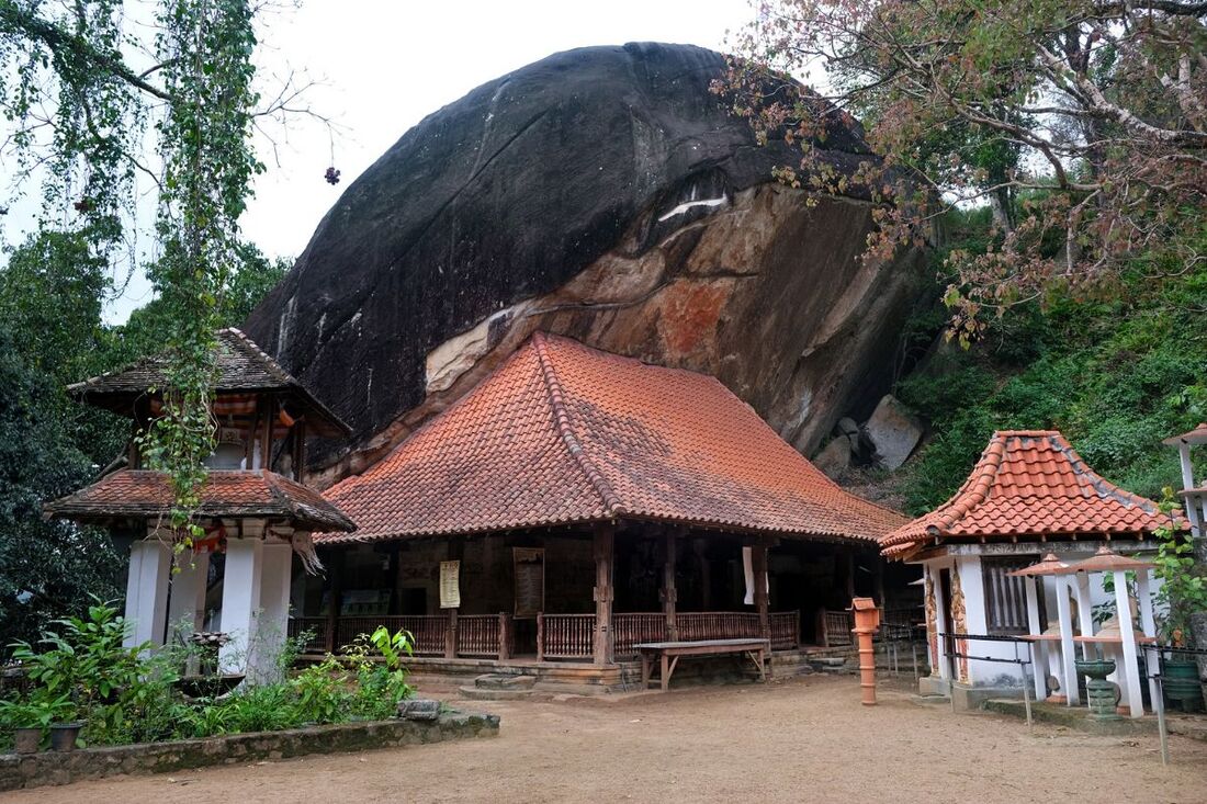 overhanging rock of the Hindagala cave temple near Peradeniya in Sri Lanka's Kandy District