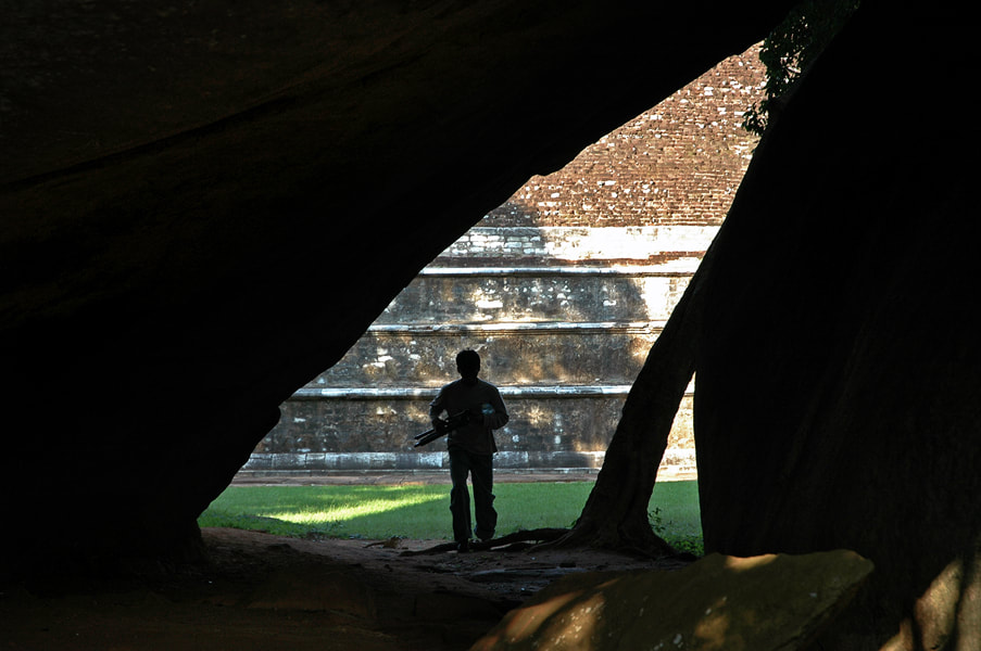 view through one of Mihintale's cave to the dome of Kantaka Chetiya