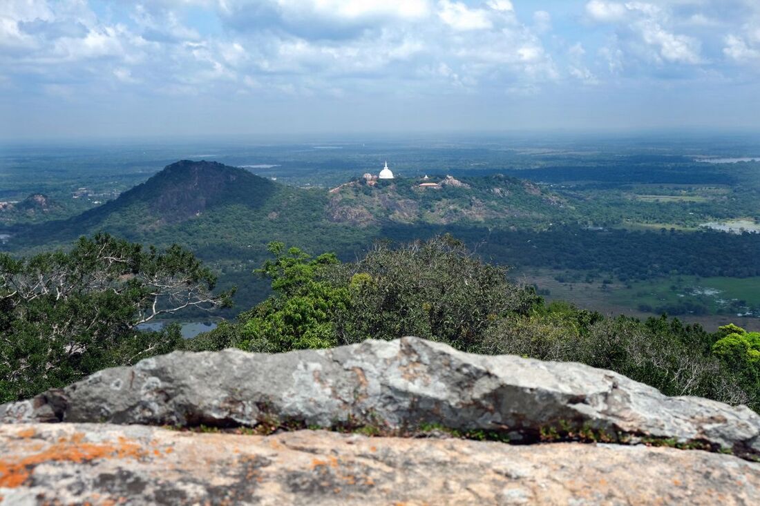 view from the top of Katupotha Kanda to the Mahaseya stupa in the hills of Mihintale