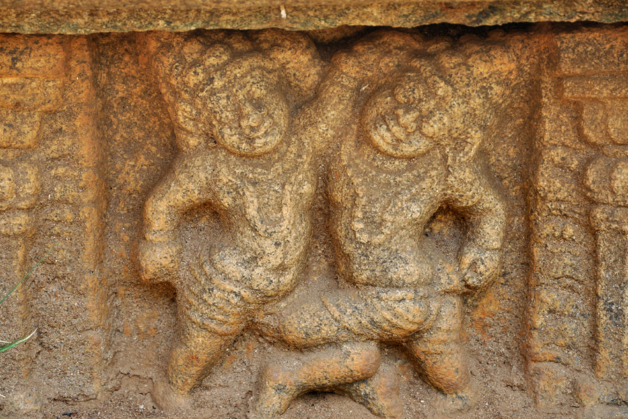 Lion Pond relief depicting wrestling dwarfs
