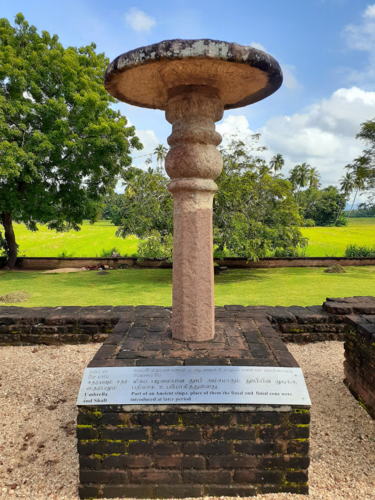 restored stone pillar on the platform of the Sandagiri stupa in Tissamaharama